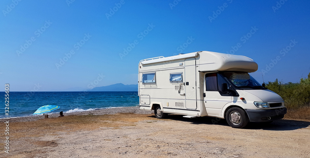caravan car by the sea in summer holidays - obrazy, fototapety, plakaty 