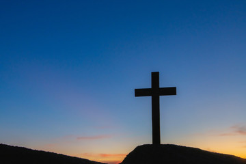 Wall Mural - The silhouette of the crucifixion of Jesus Christ - crossing at sunset