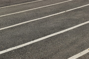 black tarmac asphalt of running track, athletic sport background