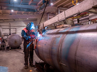Wall Mural - welding works at a Metalworking company, welder