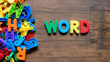 'Word' colorful word on the wooden background