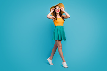 Poster - Full length photo candid cute sweet girl enjoy spring free time vacation look incredible excursion sights touch hands spectacles wear bright singlet sunhat shoes isolated blue color background