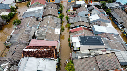 Wall Mural - Aerial POV view Depiction of flooding. devastation wrought after massive natural disasters at Bekasi - Indonesia