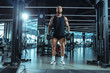 © master1305 - Leader. Young muscular caucasian athlete training in gym, doing strength exercises, practicing, work on his upper body with weights and barbell. Fitness, wellness, healthy lifestyle concept.