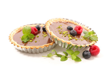 Wall Mural - delicious chocolate tart and berry fruit on white background