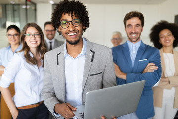 portrait of business team posing in office