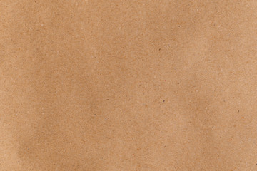 Wall Mural - Flat lay even brown wrapping paper. Abstract trendy modern paper texture background