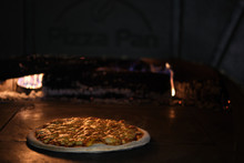 Pizza In Clay Oven With Firewood