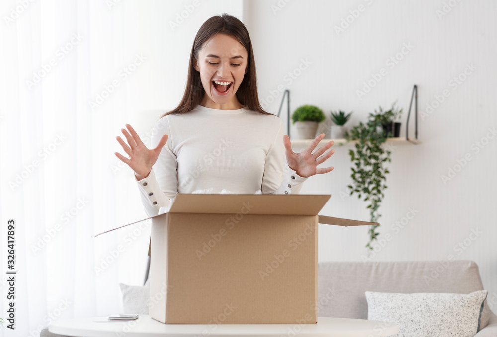 Positive client satisfied when open cardboard box parcel - obrazy, fototapety, plakaty 