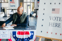 Volunteer Working At Polling Place