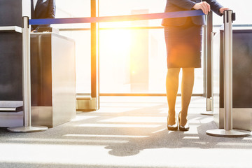 Wall Mural - Portrait of young beautiful airport staff opening the gate for boarding in airport