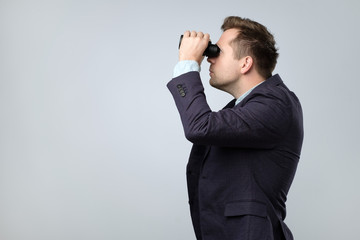 Sticker - Young businessman looking to the future through binoculars