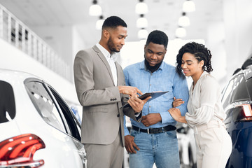 Wall Mural - Spouses Buying Car Consulting With Dealer Guy In Dealership Store