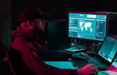 Hackers making cryptocurrency fraud using virus software and computer interface. Blockchain cyberattack, ddos and malware concept. Underground office.