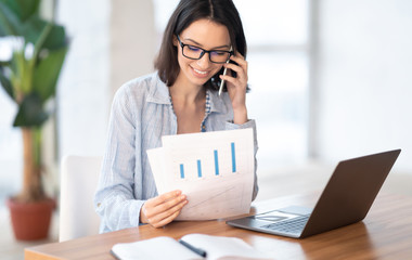 Wall Mural - Portrait of caucasian businesswoman making phone call