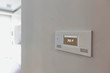 © MDBPIXS - Close up photo of modern temperature touch switch board on wall