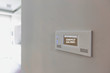 © MDBPIXS - Close up photo of modern energy saving touch switch board on wall