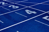 Fototapeta  - Photo of blue stadium tracks