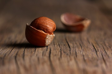 Wall Mural - nuts scattered on a wooden table with textured cracks