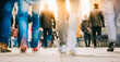 © Marko Novkov - Crowd of people walking in motion in downtown rush hour