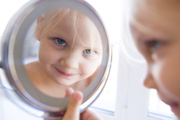 reflection little girl in mirror