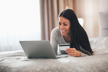 Girl trying to buy something online with her credit card.