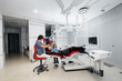 © Andrii - A little girl supports her mother during treatment at the dentist