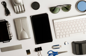 Flat assembly composition with photographic production equipment on plain white background, top view