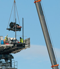 building series. crane installation on the new multistory unit building under construction. 277 mann