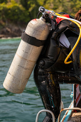 A back of woman scuba diving after explore undersea world