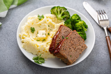 Wall Mural - Meatloaf with spicy glaze sliced on a plate with mashed potatoes and broccoli, ground beef and pork dish