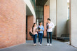 © ake1150 - Asian three students are walking and talking together in university hall during break in University. Education, Learning, Student, Campus, University, Lifestyle concept..