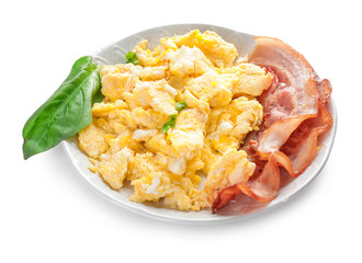 Plate with scrambled egg and bacon on white background