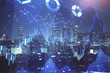 © peshkova - Financial graph on night city scape with tall buildings background multi exposure. Analysis concept.