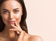 © Utkamandarinka - Beautiful woman hand touching skin manicure nails tanned skin natural make up clen fresh body care