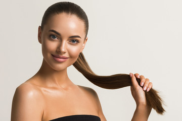 Wall Mural - beautiful hair woman long hairstyle natural clean tanned skin female face beautiful