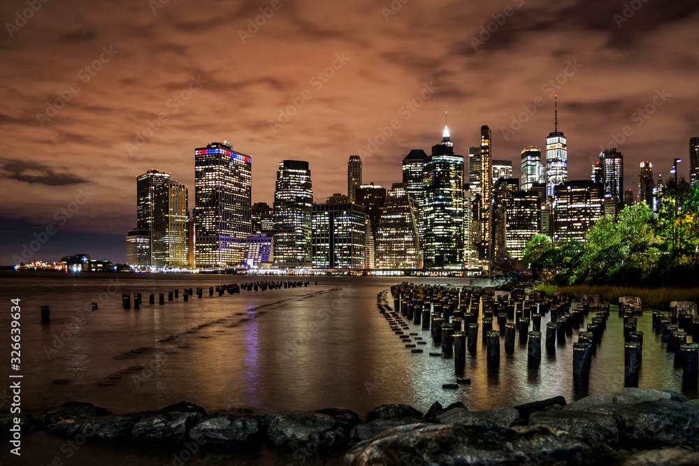 New York Financial District with skyscrapers and an old Brooklyn pier before sunrise - obrazy, fototapety, plakaty 