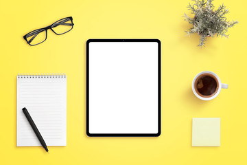 Aufkleber - Tablet mockup on yellow office desk. Isolated screen for app or web site design promotion. Pad, pen, cup of coffee, glasses and plant beside
