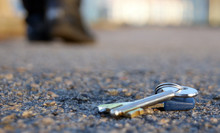 A Man Lose Keys On The Road. Losing Keys Concept.