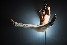Portrait Of Young Male Model Pole Dancing