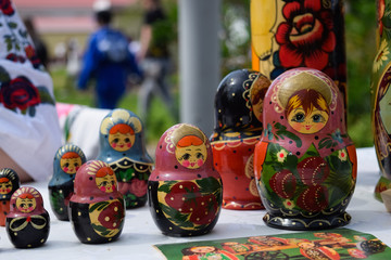 matryoshkas are on the table. National Russian art painted matryoshkas.