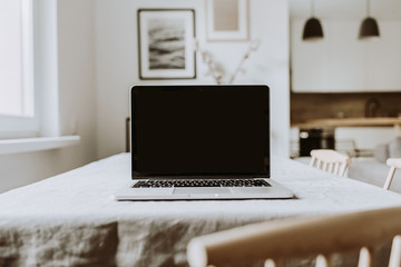 blank screen laptop. home office desk table workspace. modern nordic interior design template.