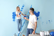 © Pixel-Shot - Happy young couple doing repair in their new house