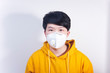 © Steve - A man wearing a N95 medical protective mask