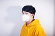 © Steve - A man wearing a N95 medical protective mask