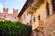 Courtyard of Casa di Giulietta House of Juliet with famous balcony of Juliet from drama William Shakespeare Romeo and Juliet in Verona, Italy. Romantic travel tourism destination