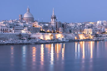 Fototapete - Mystical Valletta with Our Lady of Mount Carmel church and St. Paul's Anglican Pro-Cathedral at sunset as seen from Sliema, Valletta, Malta