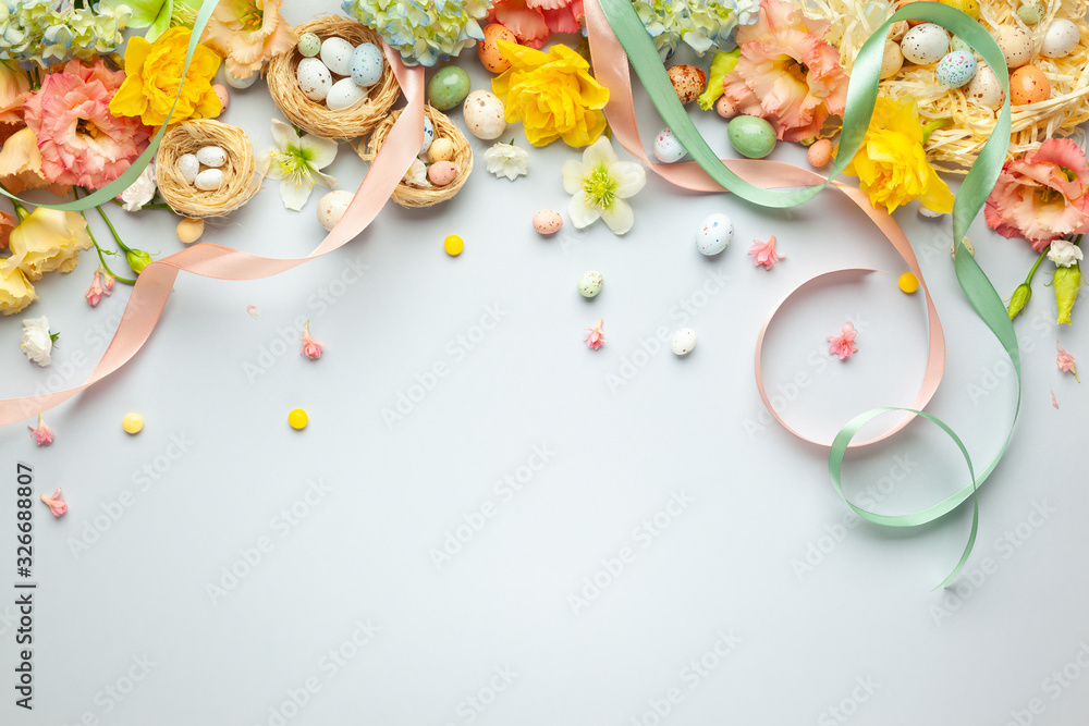 Happy Easter concept with easter eggs in nest and spring flowers ...