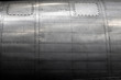 Old gray fuselage of a vintage aircraft background