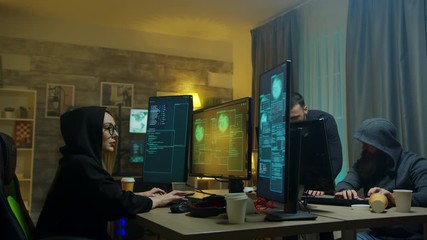 Team of cyber criminals celebrate after a successful hack